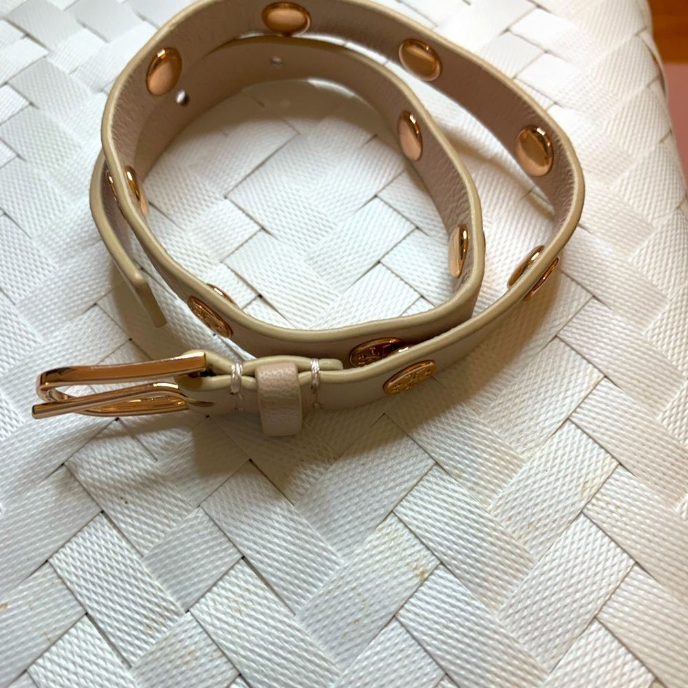 Tory Burch leather and rose gold wrap bracelet.